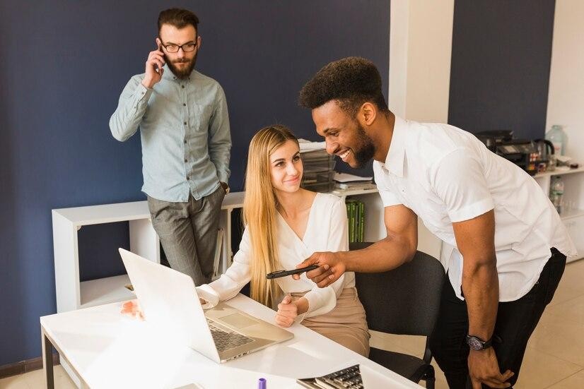 black man helping colleague